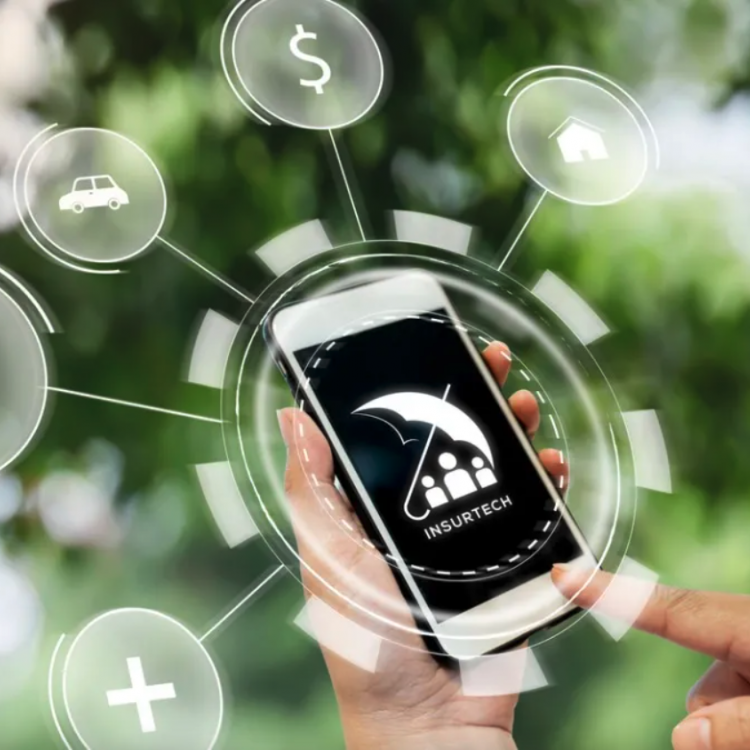 Hand holding smartphone with insurtech app open 